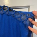 Coveted Clothing Blue Women's oversized Top size small. Photo 1