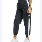 Nike Women's Sportswear Repel Essential Woven Jogger Pants Photo 1