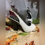 Colin Stuart  White Black Heels Photo 3