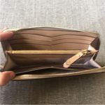 Kate Spade Full Size Gold Glitter Zippered Wallet. Photo 5