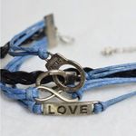 Source Unknown Retro Chic Protect Serve Love Blue/Black Leather Statement 7 Inch Bracelet Photo 2