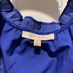 Apricot Lane  Royal blue long sleeve silky mini dress with ruffle hem Photo 3