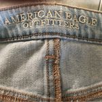 American Eagle AE Mid Rise Curvy Denim Mini Skirt Size 8 W/Fringe Hem Button-Fly Light Wash Photo 4