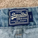 Superdry Vintage  light wash distressed high rise jean shorts in size 29 Photo 3