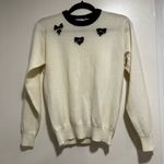 Women’s Small Cream Pullover Sweater w/ Black Bows & Jeweled Appliqué. Photo 0