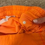 Lululemon Hotty Hot Low Rise Lined Shorts 4 Inch, Size 6 in “Highlight Orange” Photo 7