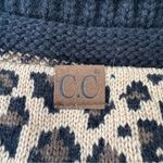 C.C. Beanie Hat Stretch Cable Knit Ribbed Super Soft Animal Print Messy Bun Black Photo 1