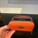 Amazon Orange Leather Wallet with Butterfly Accent Photo 1