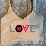 Lululemon  athletica Beige Crop Top with Pink and Black Accents Photo 0