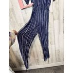 Derek Heart  stripped jumpsuit Photo 1