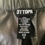 Hot Topic -GRAY AND WHITE PANTS-SIZE XS Gray pants, side hand pockets, waistband with elastic back, great condition, size XS Measurements: Waist: side to side 13-14 inches  Rise: 11 inches  Inseam: 28 inches Photo 6