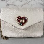 Juicy Couture  Elegant Cream Wristlet with Heart Accent Photo 1