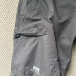 Helly Hansen  medium insulated dark grey snow pants. Adjustable waist and pockets Photo 7