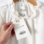 Veiled Ruffle Cinched Long Sleeve Blouse in Off White Photo 7