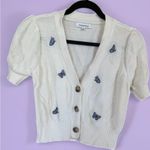 Women’s Medium Short Sleeve Sweater by Hooked Up. Butterfly detail. White Photo 1