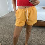 H&M  orange sweatshorts Photo 1