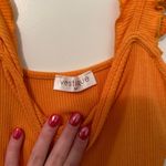 Vestique Orange Bodysuit Photo 1