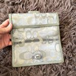 Coach  Silver/Gray and tan signature Turnlock wallet with purple lining Photo 4