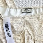 Bad Society Club OFF THE SHOULDER PRINTED JUMPSUIT in cream swirl print Photo 1