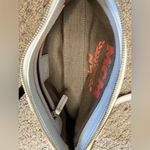 MCM  mini purse also comes with a crossbody strap Photo 4