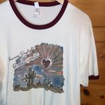 Next Level Apparel Burning daylight and breakin hearts small shop graphic tshirt Photo 1