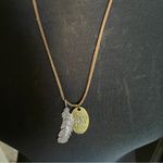 Leather Necklace with feather pendant and oval pendant that says God is Faithful Photo 3