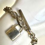 Silver tone locket charm bracelet Photo 1