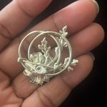 Silvertone vintage brooch with leaves and flower with double loop design Silver Photo 1