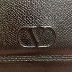 Valentino Garavani  Black Crossbody Bag with Gold Accents Photo 1