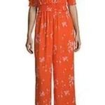 a.n.a  Women’s Vibrant Orange Floral Elbow Jumpsuit Romper Photo 1