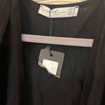 Cute black top NWT with an attached belt 🖤 Size M Photo 1