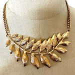 ALDO  gold tone feather leaf pendant necklace Photo 0
