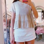 Olivia Rae Ruffly Cream T-shirt Photo 0