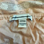 American Eagle  peach pink ruffle tank top with lace edges in size small Photo 2