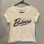 Cold Crush White Tee with Blue and Gold Print saying suck it up buttercup Photo 0