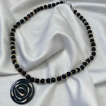 Early 2000's Geometric Black Cream Beaded Swirl Pendant Necklace Photo 0