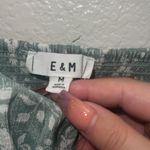 E & M  Juniors Green Floral Babydoll Smocked Back Adjustable Strap Tank Top Photo 1