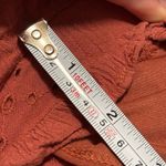 American Eagle  terracotta orange eyelet ruffle shorts Photo 3