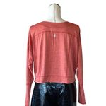 Free People NWOT  movement orange long Sleeve Top with thumbholes Oversize Photo 2