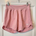 Nike womens 2-in-1 perforated
Eclipse running shorts pink Size small Photo 0