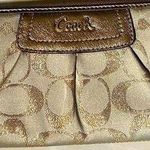 Coach  signature Charlie C zip around wallet gold with purple interior Photo 0
