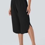 Halara Breezeful High Waisted Crossover Side Pocket Split Quick Dry Capri Photo 3