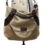 Classic Fashion Outback bag. Tan with pebbled leather handles and trim. Photo 6