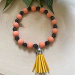 Orange & Black Silicone/Crystal Beaded Bracelet With Tassel Charm Size 8 Inches Photo 0