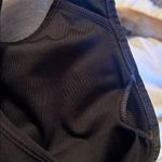 Nike  Women's Classic Dri Fit Black Sports Bra with White Logo Photo 6