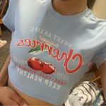 SheIn Light blue/baby blue women’s graphic crop top with “cherries” writing. Photo 0