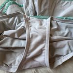 Lululemon Size 6 Turbo Running Short in white with a mint green waistband Photo 6