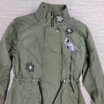 CAbi Bird Utility Jacket Women’s XXS Green Linen Sequin Appliqué Military Parka Photo 2