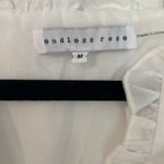 Endless Rose  Puff Sleeve Peplum Top Photo 3