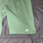 Alo Yoga  Green Bike Shorts High-Rise Performance Photo 1